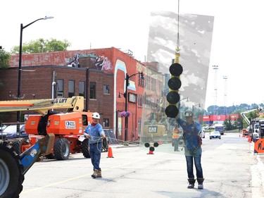 Glass panels were being installed at Place des Arts in downtown Sudbury, Ont. on Tuesday July 27, 2021. The northbound curb lane on Elgin Street between Medina Lane and Larch Street will be closed from 7 a.m. to 5 p.m. until July 29, 2021 while the work is completed. John Lappa/Sudbury Star/Postmedia Network