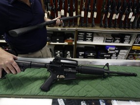 A Bush Master AR15 rifle is displayed at a weapons store in the U.S. In Canada, the federal government is banning a large number of firearms that it deems are too dangerous for citizens to posses.