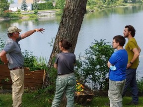 Brad Bowman, a senior environmental scientist, outlines the Minnow Lake project with team members from the Junction Creek Stewardship Group. The project is funded by the City of Greater Sudbury and the Minnow Lake Restoration Group. Supplied