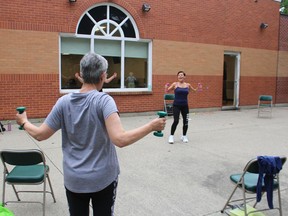 Richel Jackson leads a Build Your Bones fitness class outside the Strangway Centre in Sarnia. Paul Morden/Postmedia Network