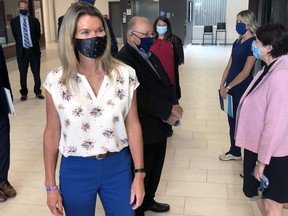 Jill Dunlop, the recently-appointed minister of Ontario's colleges and universities, greets people prior to announcing funding for Lambton College's nursing program on July 21 in Sarnia. Terry Bridge/Postmedia Network