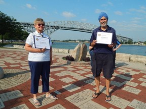 Marion Blonde (left) and Manjit Singh (right) were the 2021 recipients of the Paul Harris Fellowship, an award recognizing their significant impact in the community, given to them by the Rotary Club of Bluewaterland on July 28. Carl Hnatyshyn/Sarnia This Week