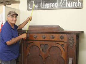 The Connaught & District Historical Society was able to obtain a few artifacts before the old United Church in Connaught was demolished last summer. The church, which had been shuttered since the 1960s, was nearly a century old. Rheal Dupuis, president of the historical society, seen here standing next to the pulpit that was retrieved from the old church, said some work is needed before the display will be ready for public viewing. The Pioneer Museum is presently closed but Dupuis is hoping they can open later this month for the remainder of the summer.

RON GRECH/The Daily Press