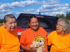 Just outside of Hearst, Walk of Sorrow leader Patricia Ballantyne, centre, is greeted by a pair of residential school survivors from Hornepayne, Jean Oliver, left, and Eva Taylor. The Walk of Sorrow, which began in Prince Albert, Sask., is expected to arrive in Timmins Sunday morning. Supplied