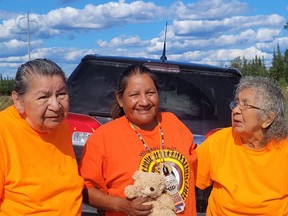 Just outside of Hearst, Walk of Sorrow leader Patricia Ballantyne, centre, is greeted by a pair of residential school survivors from Hornepayne, Jean Oliver, left, and Eva Taylor. 
Supplied