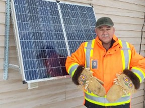 William Carey Sr. is see here with his 300 Watt solar panel which he installed at his house in Moose Factory.

Supplied