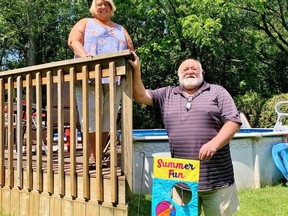 Heather Showler and Bill Swanton are among dozens of residents in a neighbourhood on the west side of Simcoe who are discouraged by the prospect of losing a large, mature woodlot near their homes. Monte Sonnenberg/Postmedia Network