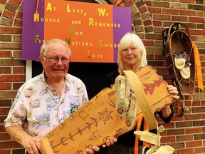 Dr. John Hall and his wife, Pat, acknowledged the grieving of First Nations on Canada Day with a display in front of their home on Main Street in Port Dover. This included signage in recognition of aboriginal children who were forced into the residential school system and empty antique cradleboards in memory of those children who never made it back home. Monte Sonnenberg