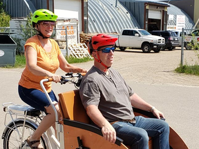 Sandi Evans and husband Dwayne test the new trishaw before training begins. PHOTO CREDIT: Age Friendly Cold Lake