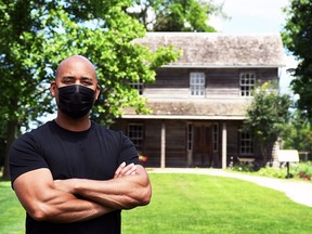 Steven Cook, site manager at Uncle Tom's Cabin Historic Site, stands in front of Josiah Henson's house until his death in 1883. Photograph taken July 21, 2021. Tom Morrison/Chatham This Week