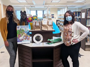 Librarians Elise Schofield (left) and Amanda Paupst display craft kits for kids. (Submitted photo)