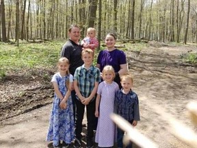 Jake and Tina Hiebert are pictured with their five children. The parents and three of the kids were badly hurt in a firepit mishap at a relative's home in Port Burwell. (Submitted)