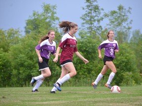 Allyson Morris (centre) paces up the field while Rachel Haak (left) and Isabella Skene (right) watch on as the D.C. Taylor Jewellers defeated the Great Lakes Pilots 1-0 Monday night at the Kiwanis Soccer Complex. Morris scored the lone goal and Lilly Green notched a shutout in the contest. Rob Gowan/The Sun Times