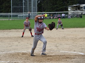 Nathan Miller winds up while second baseman Waylon Greig and right fielder Anthony Klerks look on as the Tara Twins picked up two wins this past weekend to jumpstart their 2021 fastball season. Photo submitted.