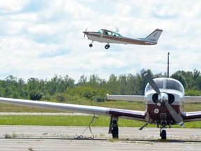 A plane takes off during the Canadian Owners and Pilots Association Flight 68's COPA for Kids event at the Wiarton Keppel International Airport on Saturday, Aug. 24, 2019.