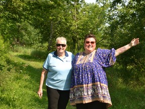 Stratford Girl Guides leader Rosemary Vail and Rotary Club of Festival City past president Christy Bertrand stand at the trail head of the T.J. Dolan Natural Area, near the intersection of O'Loane Avenue and Lorne Avenue West in Stratford, where Rotarians, girl guides and community volunteers will plant as many as 200 trees early this fall. Galen Simmons/The Beacon Herald/Postmedia Network