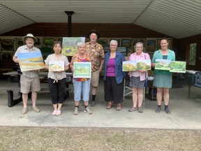 Organizer of the Art in the Park event, Scott Fitzpatrick, stands with Mimi Zhang-Mackie, Ellen Lupick, Chris Eakin, Fairview Fine Arts Society president Donna Sellers, Judy Brown and Carolyn Kosabeck. Other artists had participated as well but didn't stay long enough for a group photo at the end.