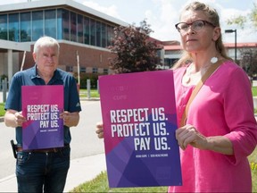 Michael Hurley, left, president of the Ontario Council of Hospital Unions in the Canadian Union of Public Employees (CUPE), and Treena Hollingworth, a porter with the Huron-Perth Healthcare Alliance and president of the union’s local branch, attend a rally Tuesday in Stratford. Hospital workers across the province are speaking out about their dissatisfaction with the Ford government as many attempt to bargain new contracts under wage restrictions passed in 2019. Chris Montanini/Stratford Beacon Herald