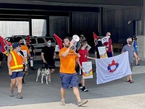 Border services officers and union officials marched towards the entry gate to Canada at the Lansdowne border crossing Thursday afternoon. The demonstration came one day before union members are set to take job action Friday morning. (MARSHALL HEALEY/The Recorder and Times)