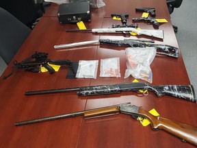 Several firearms and ammunition seized from a property on South Road in North Frontenac during the execution of a search warrant by Ontario Provincial Police on Friday.