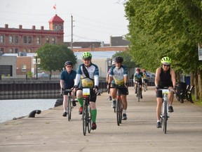 Participants in the Great Waterfront Trail Adventure cycle along Owen Sound harbour on Sunday morning.