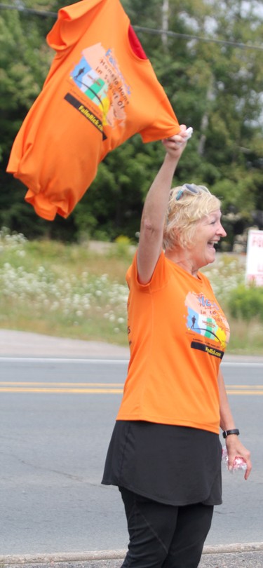 Colette Michel-Fall cheers on husband Rick Fall wrapping up his cross-country run on Saturday, Aug. 7, 2021 in Sault Ste. Marie, Ont. (BRIAN KELLY/THE SAULT STAR/POSTMEDIA NETWORK)