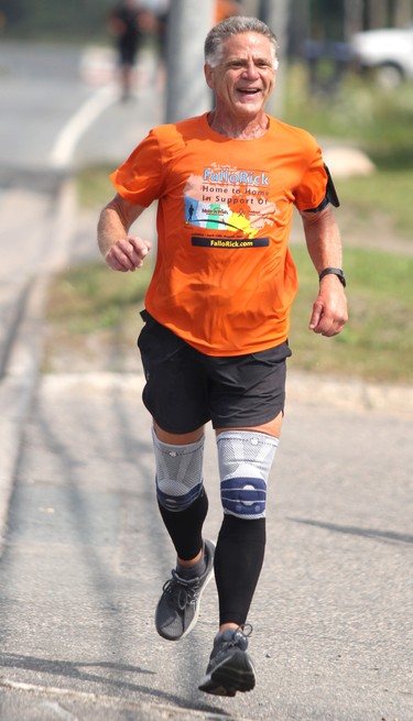 Rick Fall wraps up his cross-country run on Saturday, Aug. 7, 2021 in Sault Ste. Marie, Ont. Fall prepares to enter The Trading Post on Great Northern Road. (BRIAN KELLY/THE SAULT STAR/POSTMEDIA NETWORK)