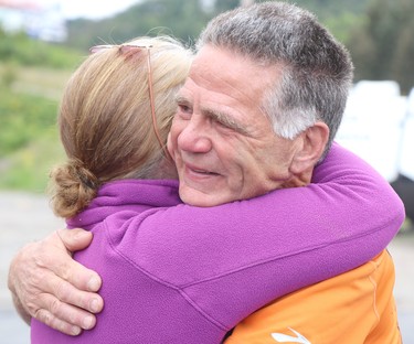 Rick Fall wraps up his cross-country run on Saturday, Aug. 7, 2021 in Sault Ste. Marie, Ont. Fall is hugged by well-wisher at Christie's RV on Great Northern Road. (BRIAN KELLY/THE SAULT STAR/POSTMEDIA NETWORK)