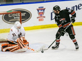 Airdrie CFR Bisons Shaw Cathcart takes a shot on Moose Jaw Warriors goalie Dylan Ernst during the Mac's AAA Tournament in 2020. The Bisons are ready for a normal season for 2021/2022. Azin Ghaffari/Postmedia