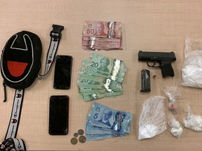 Cocaine, fentanyl, a firearm and ammunition, and cash seized by Kingston Police from a 17-year-old Oshawa teen early Monday morning.