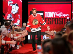 Chicago Blackhawks great Tony Esposito is introduced to fans during the Blackhawks' convention in Chicago in 2016. AP Photo/Charles Rex Arbogast