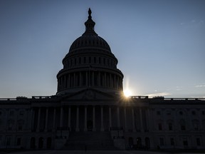 The sun begins to set behind the U.S. Capitol Building on August 8, 2021 in Washington, DC. Samuel Corum/Getty Images