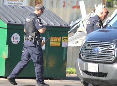 Police investigate gunfire at Hard Wok Cafe and a home at 169 Huron St., in Sault Ste. Marie, Ont., on Friday, Aug. 13, 2021. (BRIAN KELLY/THE SAULT STAR/POSTMEDIA NETWORK)