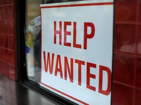 A help wanted sign is seen in this file photo.
REUTERS/Mike Blake/File Photo ORG XMIT: FW1