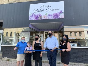 Ashleigh Fisher (third from left), owner of Creative Baked Creations in downtown Port Elgin and an unidentified child were officially welcomed to town by Chamber of Commerce Board member Michelle Kay-Scott (left), Mayor Luke Charbonneau and Chamber member Bernie Ribey.