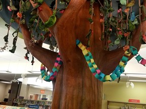 The summer reading paper chain is almost halfway around the tree at the Strathcona County Library. Participants can add links to the chain by logging their days of reading in the Preschool or Kids' Summer Challenge. Photo Supplied