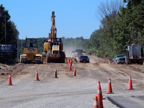 Crews work on the "hump" on Main Street West between Duchesnay and Highway 17, Wednesday.
PJ Wilson/The Nugget