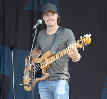 Lemon Cash bass player Dave Campbell performing on stage in Pembroke at an outdoor concert on Aug. 7.