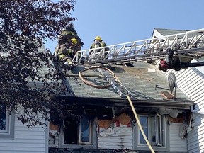 Firefighters from three stations responded to a blaze that migrated to the attic of a Chelmsford rowhouse on Wednesday afternoon.