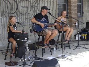 The Lapointe family performed some live French music and entertaining participants during a community barbecue at Centre Culturel La Ronde on Tuesday. The event was mainly geared toward showcasing French services in Timmins. RICHA BHOSALE/THE DAILY PRESS