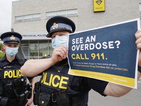 Quinte West OPP Consts. Maggie Pickett and Devin Leeworthy promote the Good Samaritan Drug Overdose Act at the detachment in Trenton. The act provides some legal protection from certain drug and breach charges when reporting overdoses.