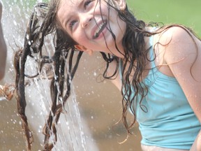Sophie St. Jules, 10, enjoys the splash pad at Bellevue Park in Sault Ste. Marie, Ont., on Friday, Aug. 20, 2021. (BRIAN KELLY/THE SAULT STAR/POSTMEDIA NETWORK)