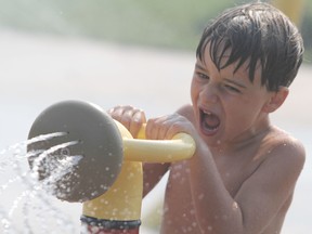 Christian Coccimiglio, 6, enjoys the splash pad at Bellevue Park in Sault Ste. Marie, Ont., on Friday, Aug. 20, 2021. He is visiting the city from Windsor, Ont. (BRIAN KELLY/THE SAULT STAR/POSTMEDIA NETWORK)