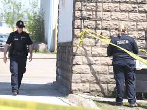 Sault Ste. Marie Police Service investigate a homicide on James Street on Tuesday, May 18, 2021 in Sault Ste. Marie, Ont. (BRIAN KELLY/THE SAULT STAR/POSTMEDIA NETWORK)