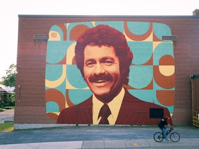 A mural depicting Alex Trebek graces the side of Sudbury Secondary School, which the late Jeopardy host attended in his youth. The tribute, created by artist Kevin Ledo, was completed on Friday.