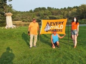 Roger Daybutch from Mississauga FN, Robert Stoneypoint from Sagamok, and Elizabeth Cassidy at the Spanish Vigil for residential school children.