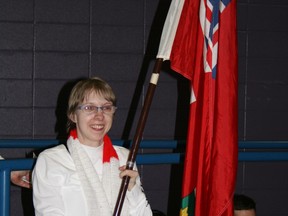 Laidler carrying the Ontario flag at Nationals in St Albert, Alberta 2012. SUBMITTED