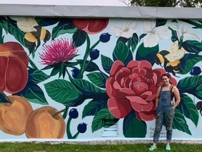 Young artist Kathleen Van den Hogen stands in front of her mural at the rock gardens in Kincardine. SUBMITTED