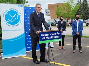 Premier Brian Pallister announced a new hospital will be built in Portage la Prairie. He was joined by Jane Curtis (middle), Chief Executive Officer, and  Dr. Ed Tan (right) with the Portage District General Hospital. (Aaron Wilgosh/Postmedia)