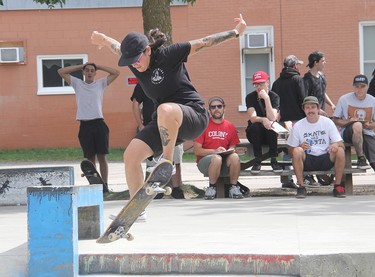 No fear! Jaquie Carbajal leaps down the stairs, while flipping her board several times in mid-air at the Heavy Medal Skateboard Competition and Showcase in Pembroke. Carbajal went on to take top spot in the Ladies' Division.